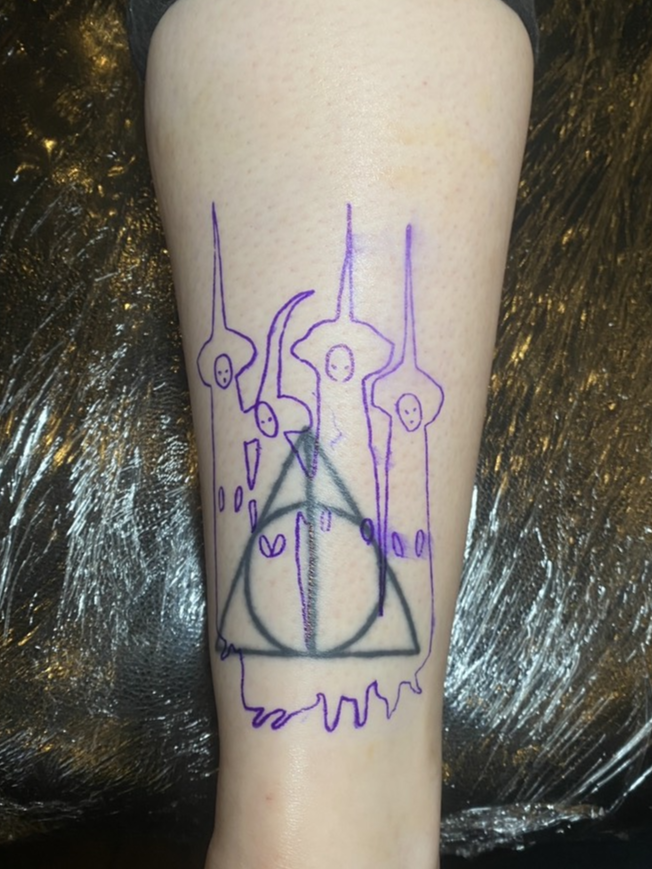 Deathly Hallows Sign Tattoo costs explained? Save money on your Harry Potter ink.